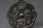 唐代文物＂双鸟衔带龙纹葵花式铜镜＂：多种纹样共聚一堂